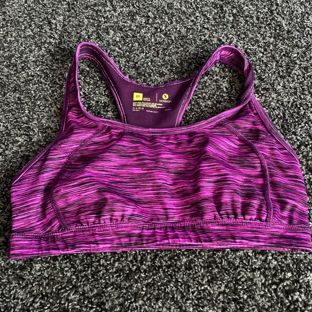 Pink and purple medium support sports bra